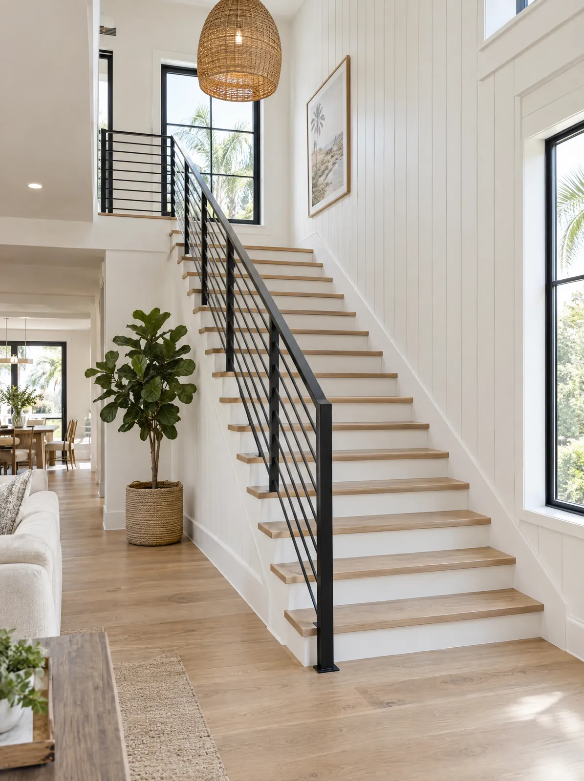 Modern staircase with white oak treads and black metal railing